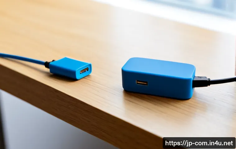 USB 3 0과 USB C 포트의 차이 - Photorealistic close-up comparison on a clean light-wood desk: a classic rectangular USB Type-A plug...